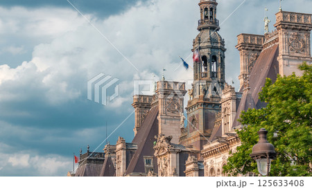 Architecture of The Hotel de Ville City Hall with french flag on tower timelapse, the building housing the local administration of the city of Paris 125633408