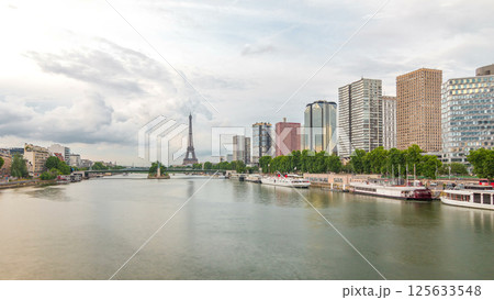 The Statue of Liberty and the Eiffel Tower timelapse hyperlapse with modern buildings. Paris, France The Statue of Liberty and the Eiffel Tower timelapse hyperlapse with modern buildings. Paris, France 125633548