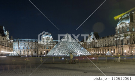 View of famous Louvre Museum with Louvre Pyramid at night timelapse hyperlapse. Paris, France 125633561