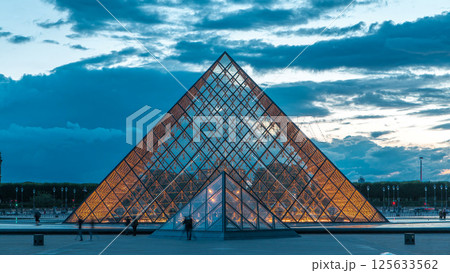 The Louvre museum pyramid after sunset day to night timelapse in Paris, France 125633562