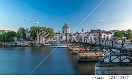 People walk on the Bridge of Arts over the River Seine to the Institute of France timelapse hyperlapse - Paris, France People walk on the Bridge of Arts over the River Seine to the Institute of France timelapse hyperlapse - Paris, France 125633587