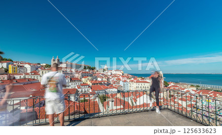 Tourists enjoying the view from belvedere Miradouro das Portas do Sol timelapse hyperlapse. Lisbon, Portugal 125633623