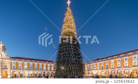Commerce Square in Lisbon illuminated at Christmas day to night hyperlapse, with a towering tree. Portugal 125633632
