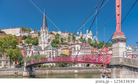 Timelapse hyperlapse of Saint George Church, Quais de Saone, and Fourviere Basilica from a footbridge in Vieux Lyon, France 125633639