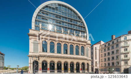 Hyperlapse of Lyon's opera house featuring neoclassical architecture combined with a modern glass dome roof. France Hyperlapse of Lyon's opera house featuring neoclassical architecture combined with a modern glass dome roof. France 125633643