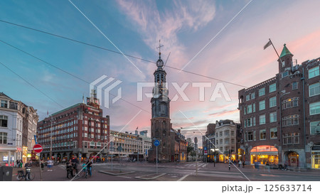 Munttoren tower and flowers market. Panoramic day to night timelapse hyperlapse of Amsterdam city center. Netherlands Munttoren tower and flowers market. Panoramic day to night timelapse hyperlapse of Amsterdam city center. Netherlands 125633714