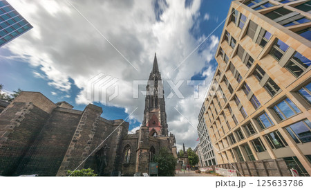 Looking up perspective to the facade of Ehemalige Hauptkirche St. Nikolai timelapse hyperlapse in Hamburg, Germany 125633786