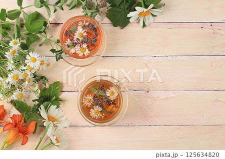 Floral composition of wild herbs and flowers on a wooden table in a rustic style, autumn background, tansy, Floral composition of wild herbs and flowers on a wooden table in a rustic style, autumn background, tansy, 125634820