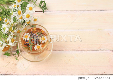 Floral composition of wild herbs and flowers on a wooden table in a rustic style, autumn background, tansy, Floral composition of wild herbs and flowers on a wooden table in a rustic style, autumn background, tansy, 125634823