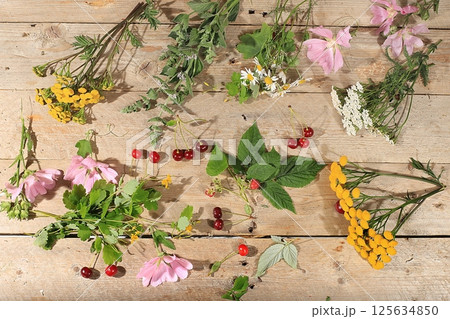 Floral composition of wild herbs and flowers on a wooden table in a rustic style, autumn background, tansy, Floral composition of wild herbs and flowers on a wooden table in a rustic style, autumn background, tansy, 125634850