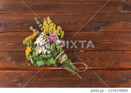 Floral composition of wild herbs and flowers on a wooden table in a rustic style, autumn background, tansy, Floral composition of wild herbs and flowers on a wooden table in a rustic style, autumn background, tansy, 125634860