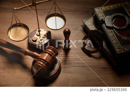 Judge gavel and legal book on wooden table 125635160