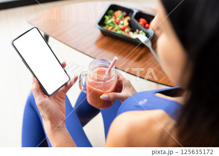 Smartphone mockup, woman holding phone 125635172