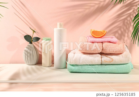 Abstract background with natural wooden podiums and long shadows on a pink wall, an empty showcase for cosmetic products demonstration or presentation, minimal ecology concept, selective focus 125635185