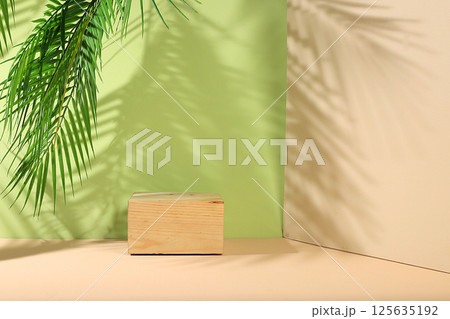 Abstract background with natural wooden podiums and long shadows on a pink wall, an empty showcase for cosmetic products demonstration or presentation, minimal ecology concept, selective focus 125635192