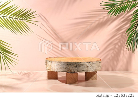 Abstract background with natural wooden podiums and long shadows on a pink wall, an empty showcase for cosmetic products demonstration or presentation, minimal ecology concept, selective focus 125635223