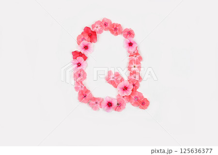 A letter Q made from real fresh flowers. Creative floral font concept. Unique collection of letters and numbers for design. Spring, summer, autumn and valentines, creative idea 125636377