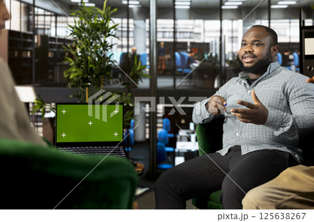 Isolated screen laptop used by coworkers preparing for business meeting, having discussion. Chroma key notebook used by teamworking employees doing research analysis for startup organization 125638267