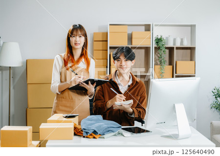 Starting small businesses SME owners, two check online orders Selling products working with boxs freelance work , marketing, Business Success and Productivity Starting small businesses SME owners, two check online orders Selling products working with boxs freelance work , marketing, Business Success and Productivity 125640490