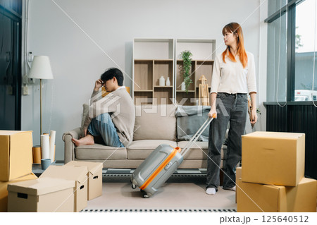 Divorce. Asian couples are desperate and disappointed after marriage. Husband and wife are sad, upset and frustrated after quarrels. 125640512