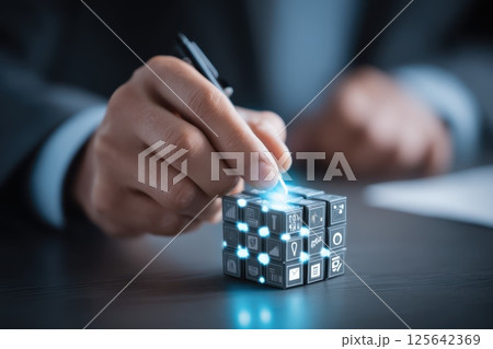 Businessperson Unlocking Data Insights with Abstract Glowing Cube Concept in Modern Office Setting 125642369
