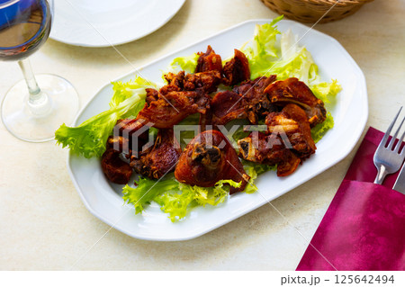 Traditional roasted pork with fried potatoes Traditional roasted pork with fried potatoes 125642494