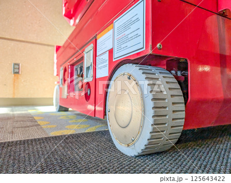 Selective focus on the front wheel of a scissor lift Selective focus on the front wheel of a scissor lift 125643422