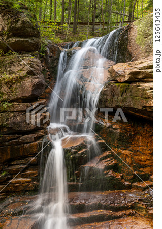 Long exposure Cascading waterfall at Flume Gorge in the Franconia Notch State Park 125643435
