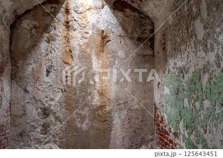 Chipped and peeling lead based paint on an old wall. Chipped and peeling lead based paint on an old wall. 125643451