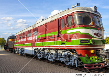 Red orange vintage retro train trains steam locomotive locomotives Belarus. 125644242