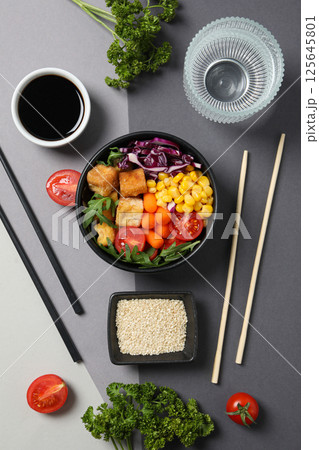 Fried tofu salad with sticks and soy sauce Fried tofu salad with sticks and soy sauce 125645801