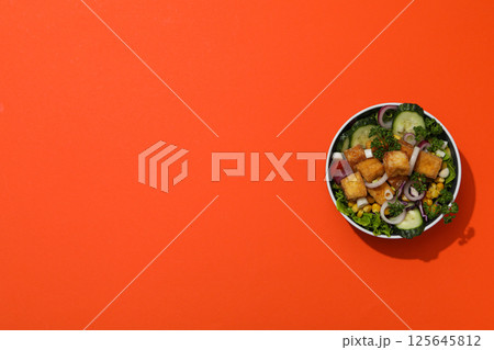 Fried tofu salad in a bowl, top view 125645812