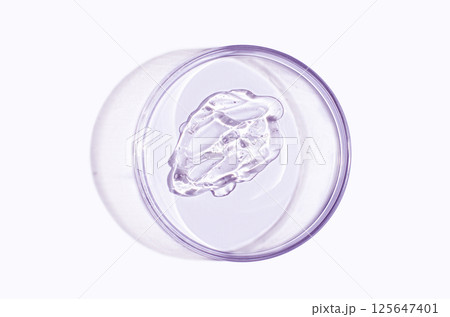Skin serum or face wash gel in a Petri dish. For cosmetic procedures. 125647401