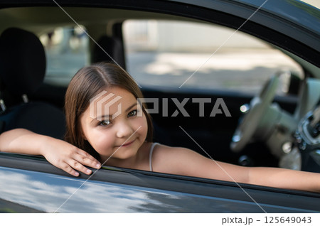 Little kid traveling in vehicle sitting in automobile Little kid traveling in vehicle sitting in automobile 125649043