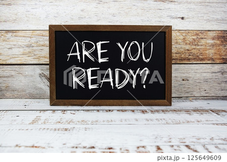 Are You Ready? typography text on wooden blackboard 125649609