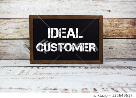 Ideal Customer typography text on wooden blackboard Ideal Customer typography text on wooden blackboard 125649617