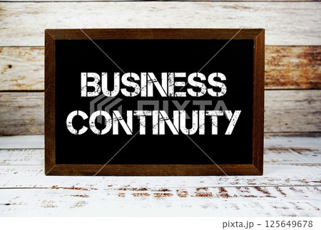 Business Continuity typography text on wooden blackboard 125649678