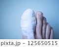 Foot big toe bandage injury 125650515
