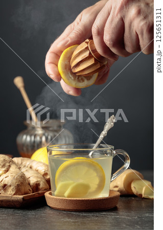 Ginger tea with lemon and honey. Ginger tea with lemon and honey. 125651311