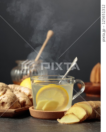 Ginger tea with lemon and honey. 125651312