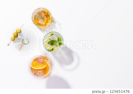 A vibrant display of cocktails, including Aperol Spritz, Mojito, and Martini A vibrant display of cocktails, including Aperol Spritz, Mojito, and Martini 125651476