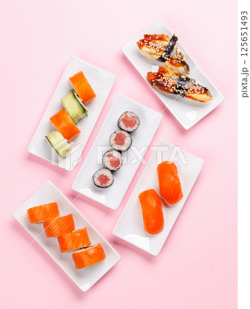 Assorted sushi and maki rolls beautifully arranged on plates Assorted sushi and maki rolls beautifully arranged on plates 125651493