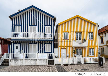 Street with colorful houses. Street with striped houses, Costa Nova, Aveiro, Portugal Street with colorful houses. Street with striped houses, Costa Nova, Aveiro, Portugal 125653263