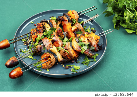 Roasted sweet potato on skewers. 125653644