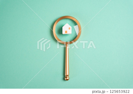 House and magnifying glass. Housing search concept. Real estate market analysis, property inspections, and comparing listings. Locate ideal housing opportunities for buyers and renters House and magnifying glass. Housing search concept. Real estate market analysis, property inspections, and comparing listings. Locate ideal housing opportunities for buyers and renters 125653922