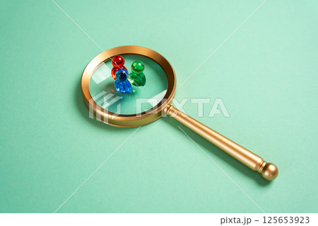 Figures of people and a magnifying glass. Search for recruitment. Social research. Human resources, demographic studies, and talent scouting shape organizational and research success. Figures of people and a magnifying glass. Search for recruitment. Social research. Human resources, demographic studies, and talent scouting shape organizational and research success. 125653923
