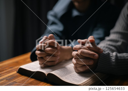 In moment of meditation, the congregation began praying and praising, seeking the grace and forgiveness of the Holy Spirit, as they embraced the spirit of fellowship and the teachings of the gospel. 125654633