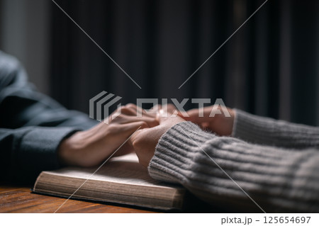 In moment of meditation, the congregation began praying and praising, seeking the grace and forgiveness of the Holy Spirit, as they embraced the spirit of fellowship and the teachings of the gospel. 125654697