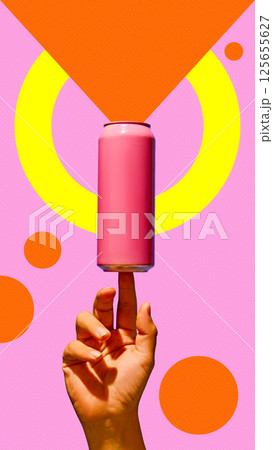 Pink drink can perfectly balanced on finger against surreal pink, yellow, orange collage with geometric patterns. Pink drink can perfectly balanced on finger against surreal pink, yellow, orange collage with geometric patterns. 125655627