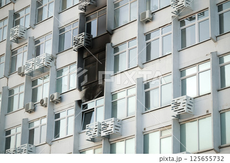 Consequences of a fire in a multi-storey building. Damaged multi-storey building, the aftermath of the explosion Consequences of a fire in a multi-storey building. Damaged multi-storey building, the aftermath of the explosion 125655732